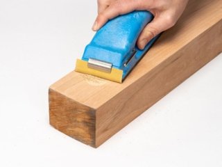 A person sands WoodFil EPOXY.